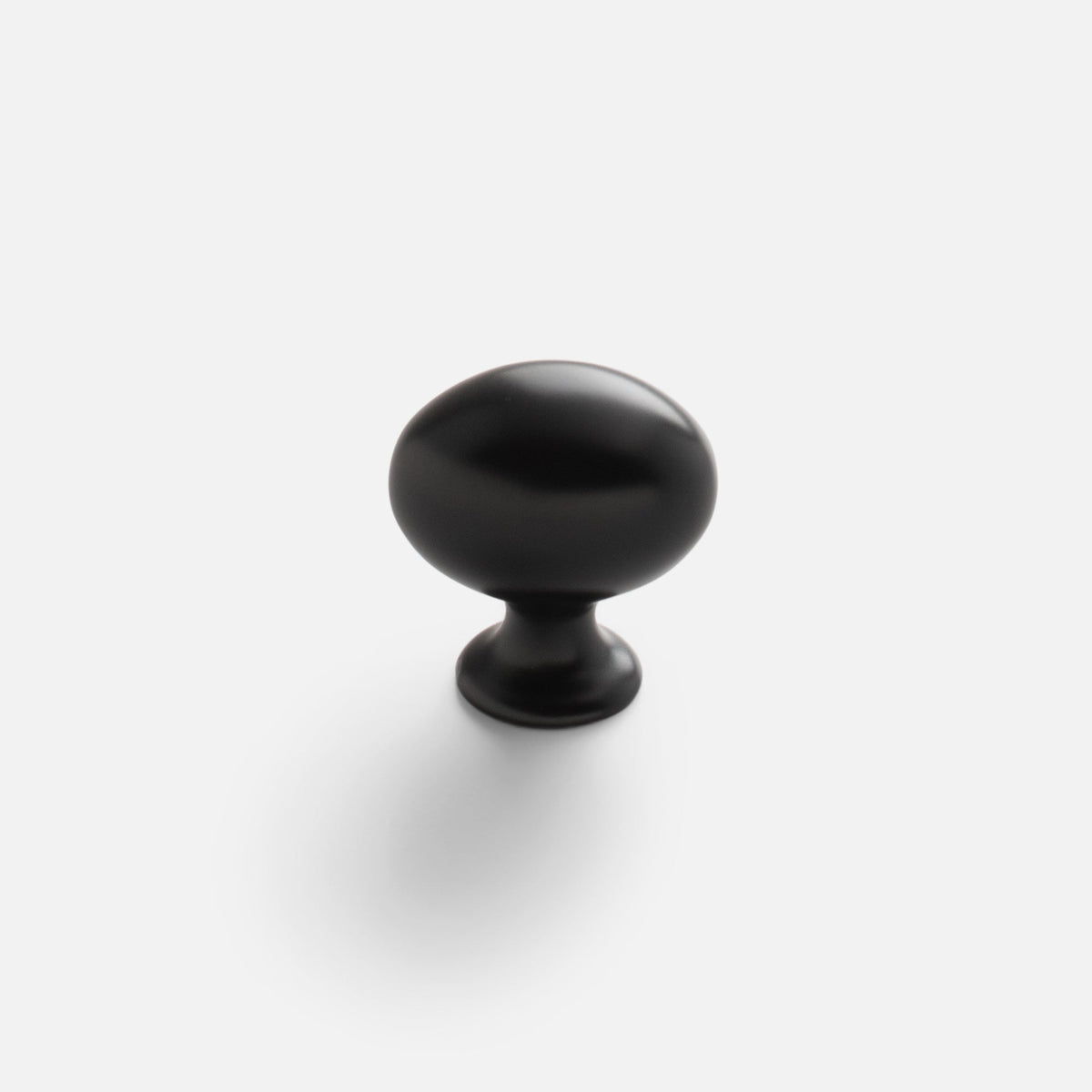 Front view of Somerset Knob showcasing its egg-shaped silhouette in a black finish against a white background