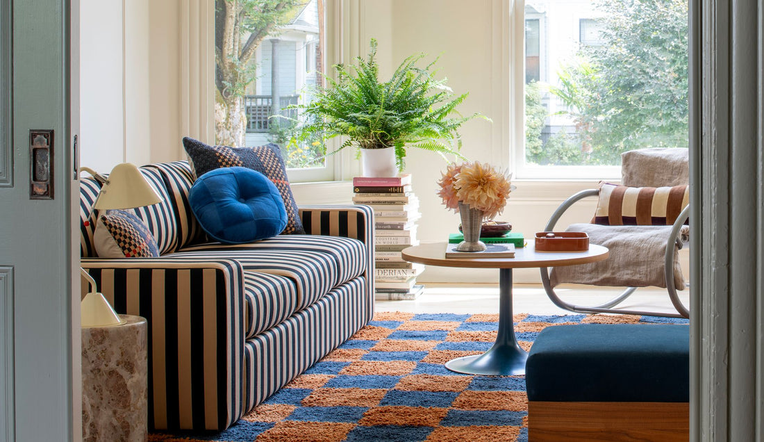 Layered living room with striped couch