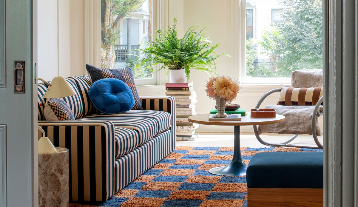 Layered living room with striped couch