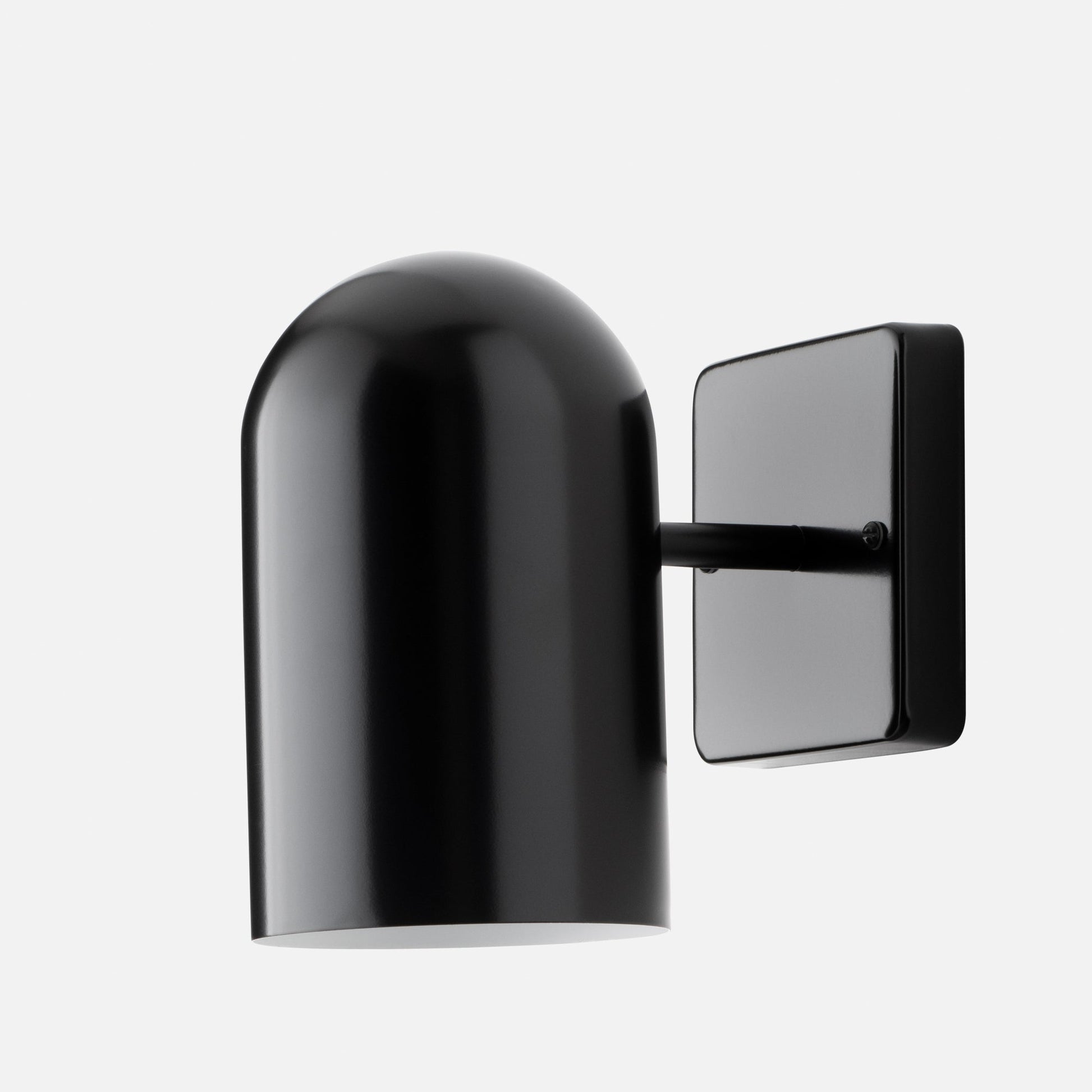 Close-up of Allegheny 4.5-inch sconce showing glossy black cylindrical shade and rectangular wall plate on white background