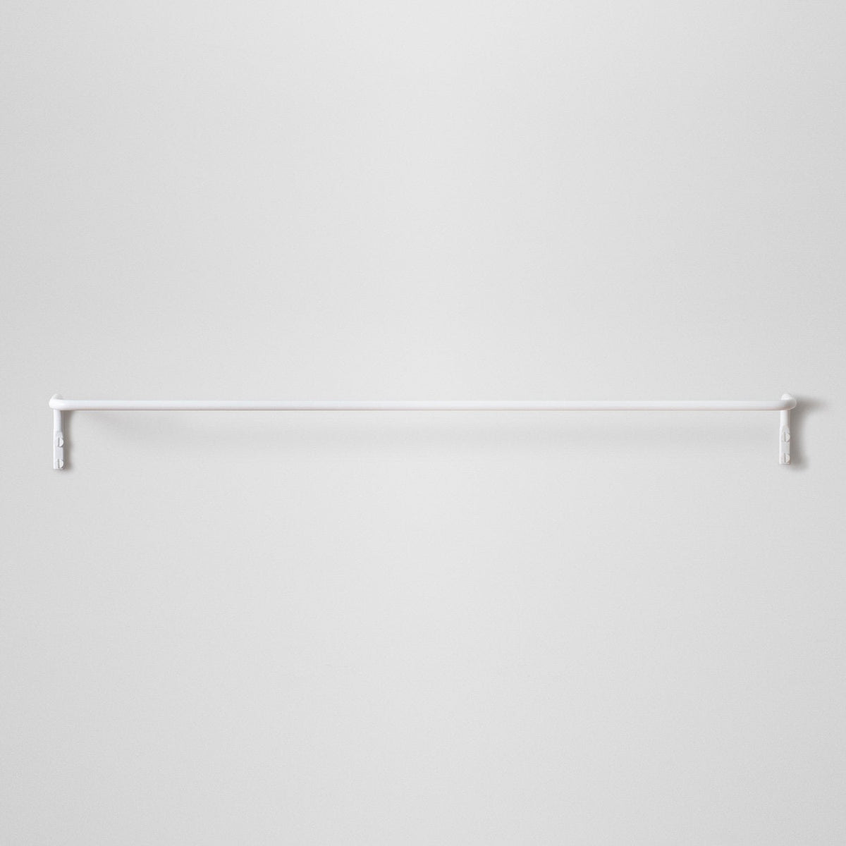 Front view of the white Mara Towel Bar showcasing its sleek wall-mounted design against a light gray background