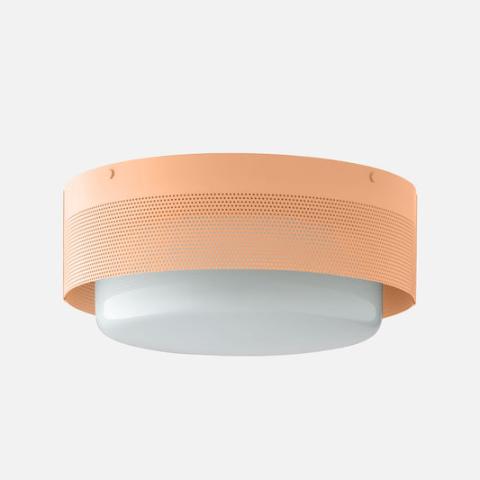 Front underside view of Harlow Flush Mount with perforated steel shade, white diffuser, and Bellini satin finish on light gray