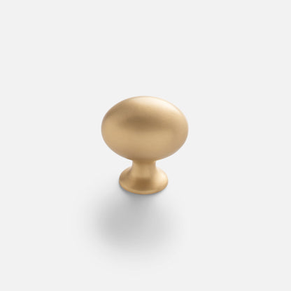 Front view of Somerset Knob showcasing its egg-shaped solid brass silhouette with a white background
