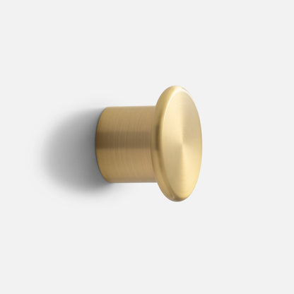 Close-up side view of Remy Single Hook showcasing its cylindrical form and round face on a white background