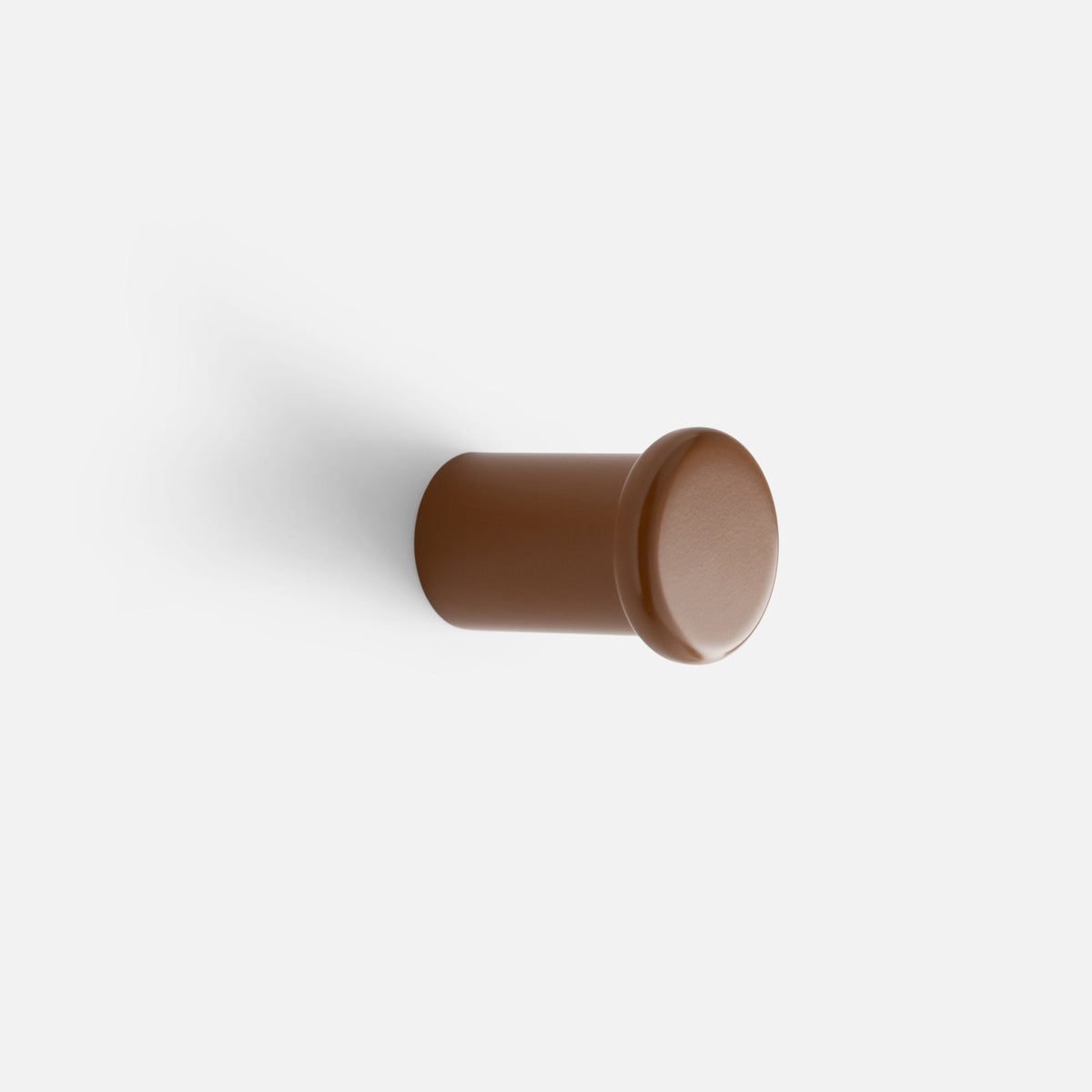 Side view of Remy Single Hook showcasing its cylindrical form and rounded face against a white background