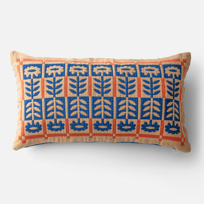 Front view of Stillwater Floral Sham showing blue mirrored floral applique and orange grid on tan cotton