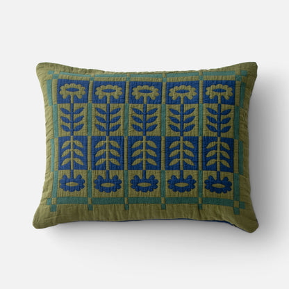 Front view of Stillwater Floral Sham showing green and blue mirrored floral applique on quilted cotton on white background