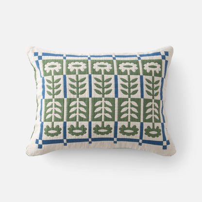Front view of Stillwater Floral Sham showing green and blue mirrored floral applique grid on cream fabric, white background