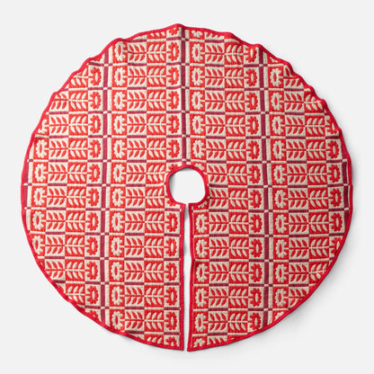 Top view of Stillwater Tree Skirt showcasing red jacquard floral pattern with center opening and slit on a light background
