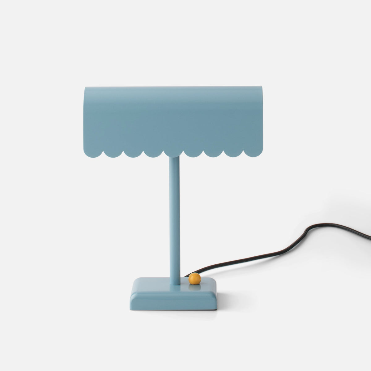 Front view of Dolores Table Lamp showcasing its scalloped edge and contrasting dimmer knob on a white background