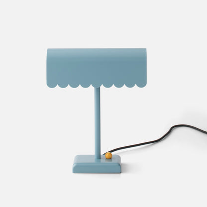 Front view of Dolores Table Lamp showcasing its scalloped edge and contrasting dimmer knob on a white background