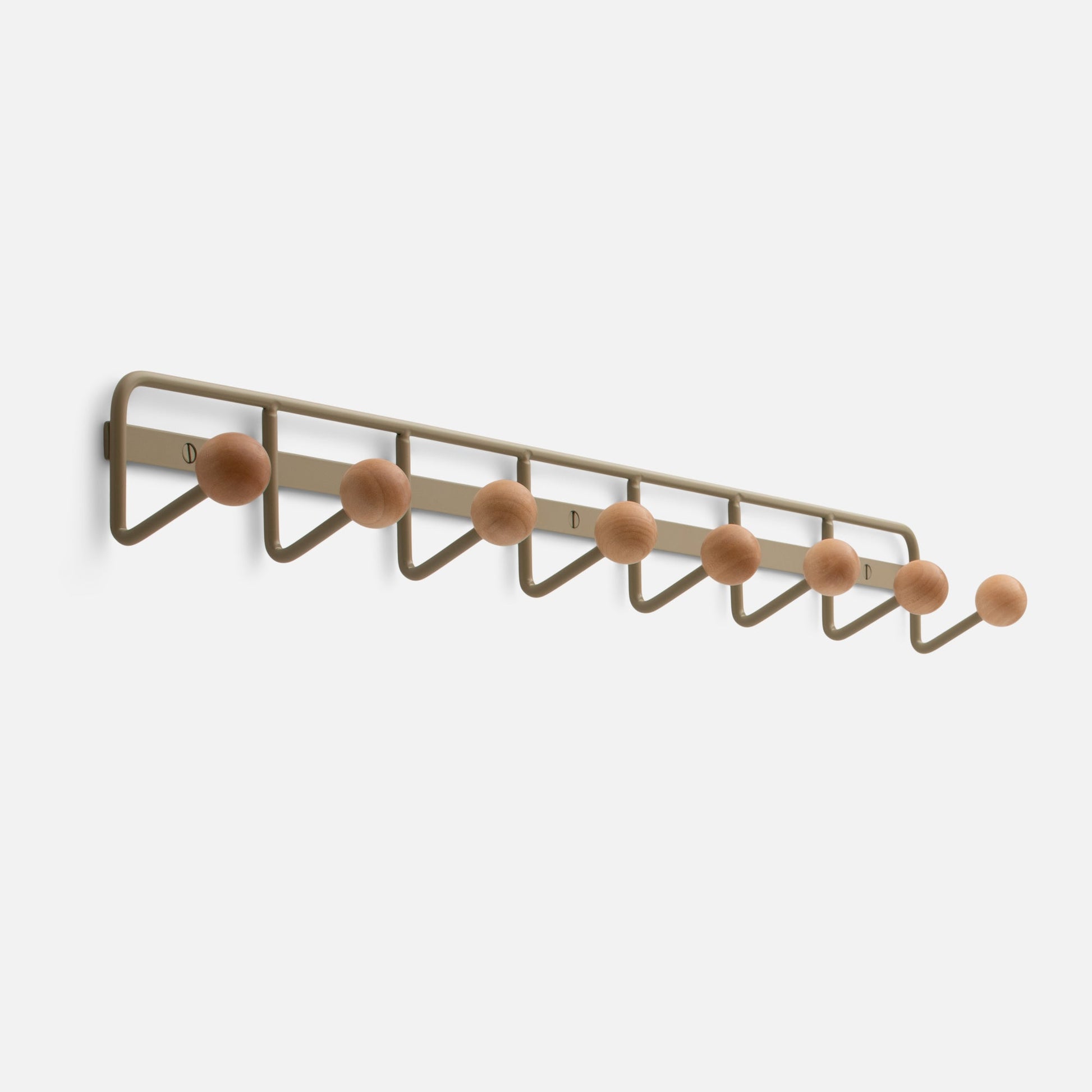 Angled view of Mollie Multi Hook showcasing seven oak knobs on a painted steel wall rack with white background