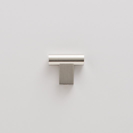 Front view of T Pull showing satin nickel cylindrical top and square mounting base on light gray background