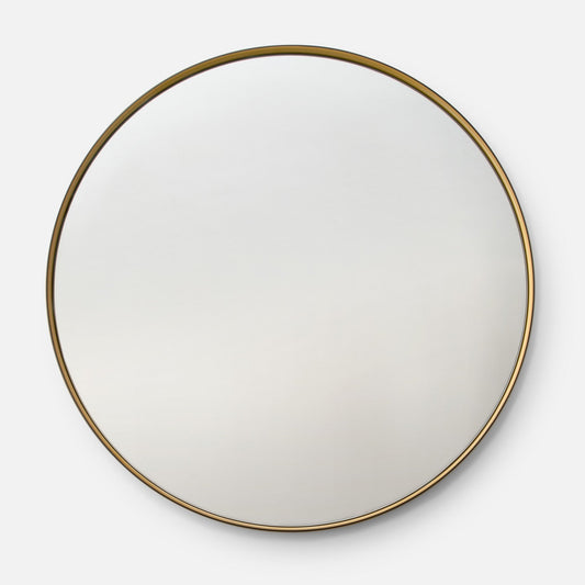 Front view of Grant Mirror round showcasing a thin marigold metal frame and round glass on a light gray background