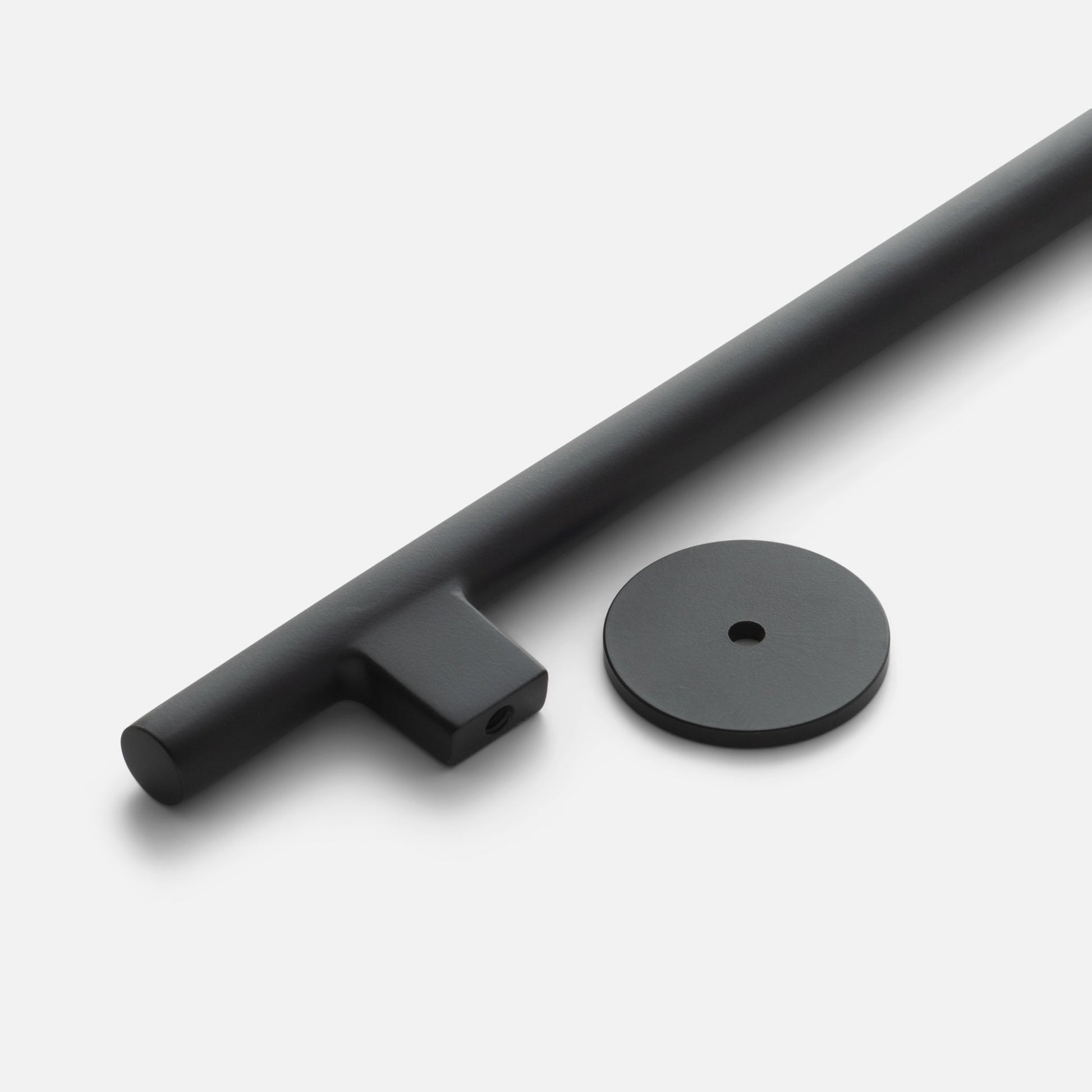 Angled close-up of Galley Pull showcasing True Black matte finish and round backplate on white background