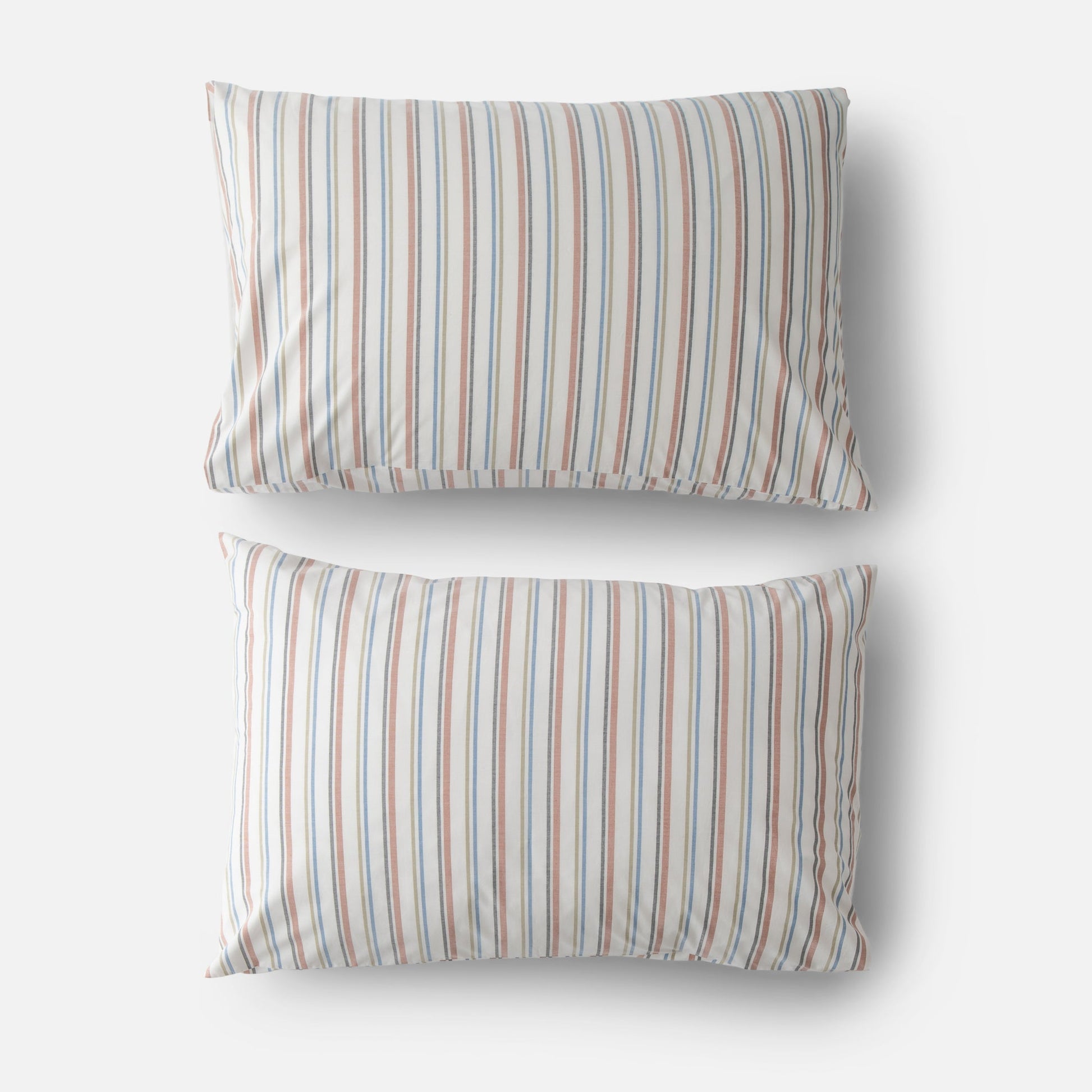 Top view of two Fresh Stripe percale pillowcases with blue and rust vertical stripes on white background
