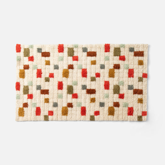 Overhead view of Pixel Handloom Shag Rug showing multicolor pixel tufted design and thick handloom shag texture on white background