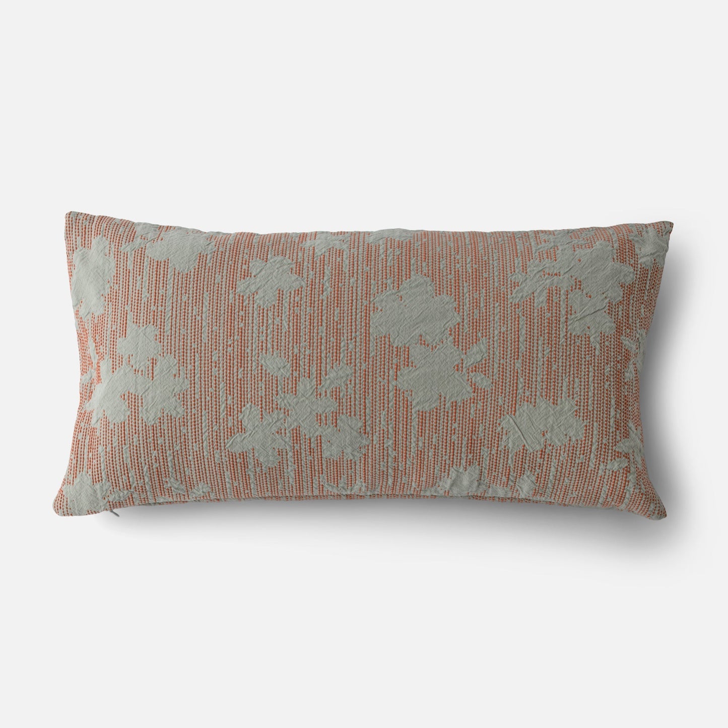 Front view of Shadow Floral Jacquard pillow showcasing coral woven background with pale blue floral jacquard, 12 by 24 inches, on white background